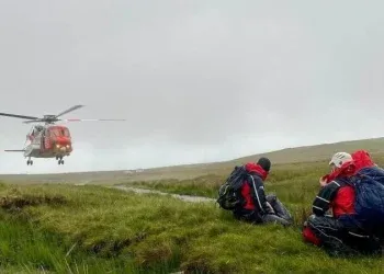 Rescuers await the departure of the Coast Guard helicopter following the handover of the casualties at Benbulbin (Pic: SLMRT responder D Barnes)