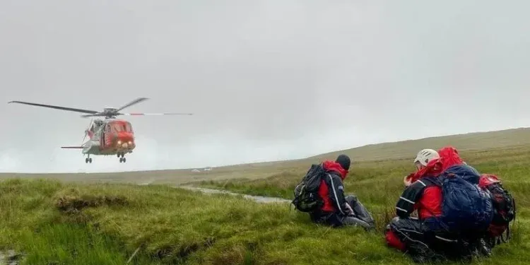 Rescuers await the departure of the Coast Guard helicopter following the handover of the casualties at Benbulbin (Pic: SLMRT responder D Barnes)