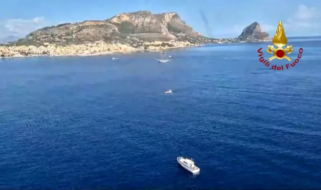 An Italian Coast Guard ship is seen at the site of the sunken vessel on near Palermo. Photograph: Corpo Nazionale dei Vigili dei del Fuoco via Getty